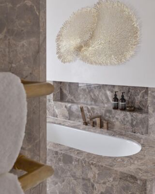 The principal ensuite at our Knightsbridge square project. Love the warm tones of this Fior Di Bosco marble and the little niches we designed in the vanity unit which display the monogrammed towels from our @coze_linen collection perfectly. #marble #bathroom #luxinteriors 📷 @raymain57